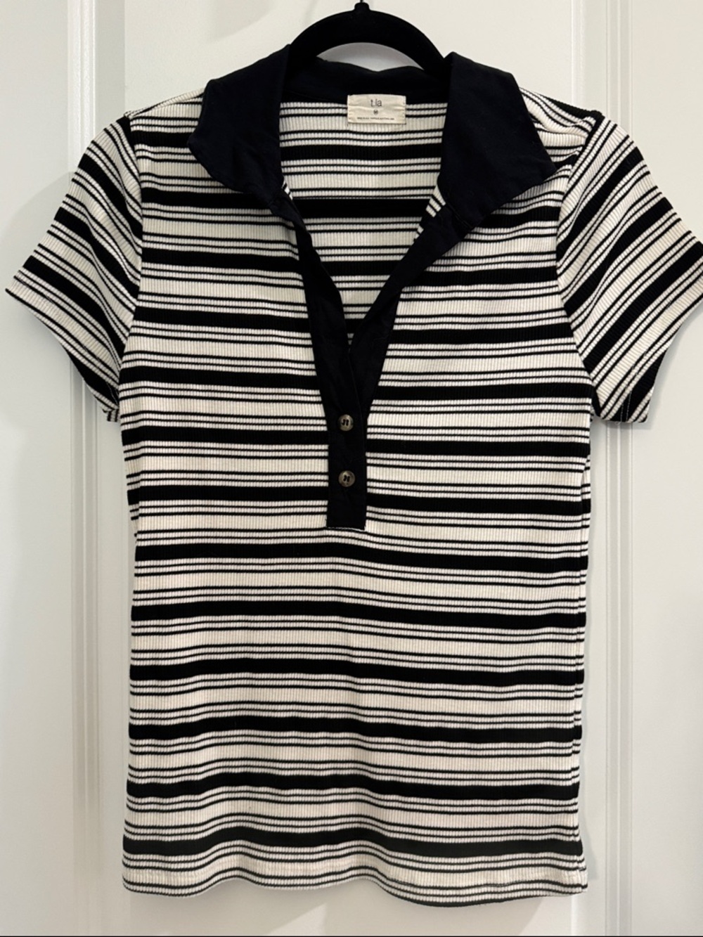 Black and white striped rib knit polo